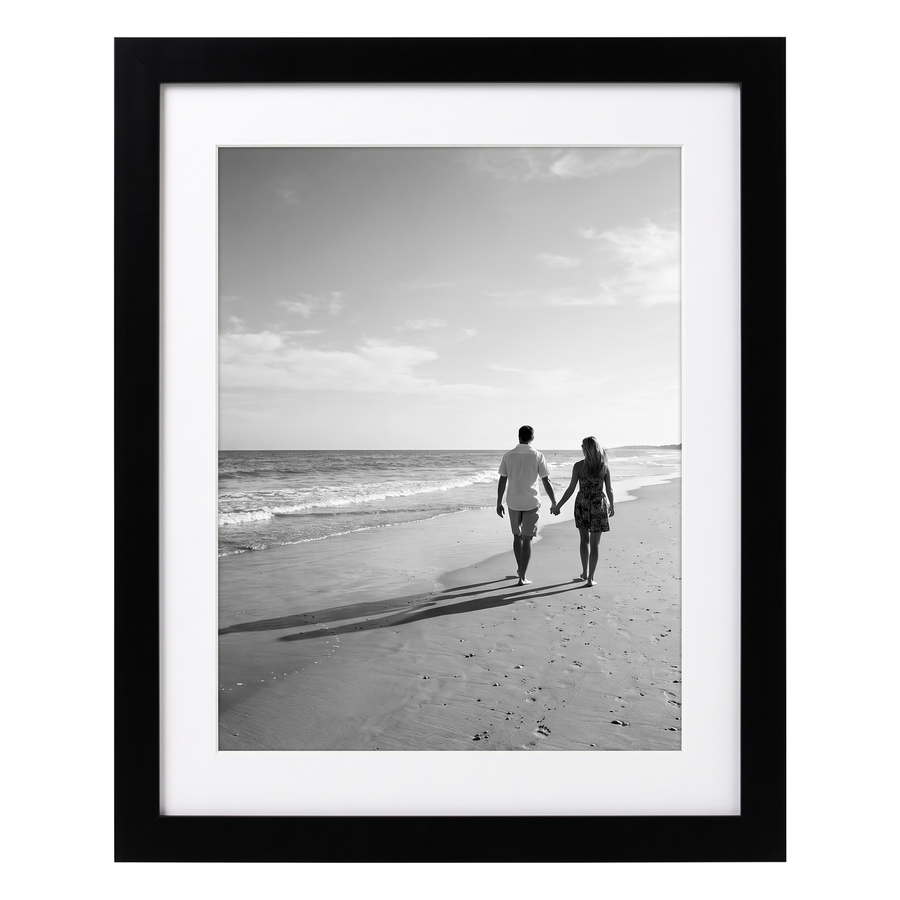 Black Signature frame, 10x12, with a wide white mat, holding a photo of a couple casting long shadows 