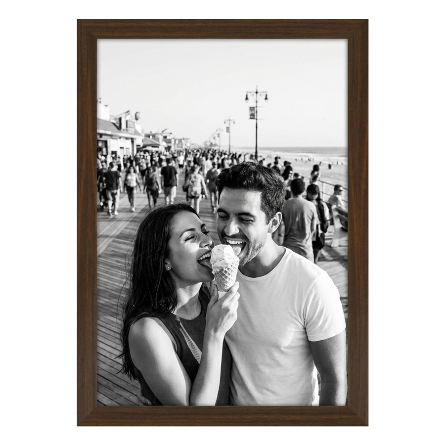 Walnut Signature frame, 12x18, no mat, holding a photo of a couple sharing an ice cream 