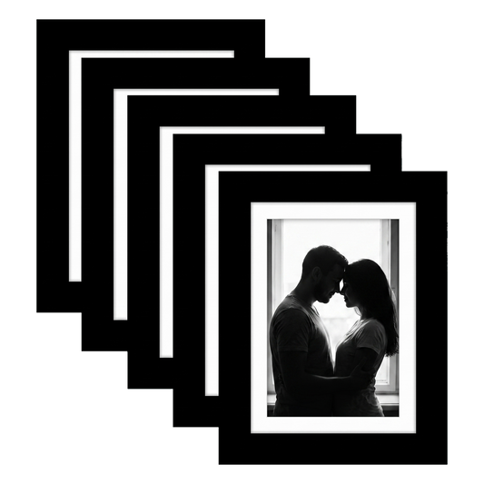 Five stacked black Galleria frames with white mats, holding a photo of a couple at a bright window #flat