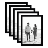 Five stacked black 5x7 Galleria frames, the front one holding a couple walking on a beach 