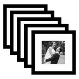 Five stacked black Galleria frames with white mats, holding a photo of a bride and groom laughing 