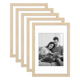Five stacked natural oak Galleria frames with white mats, holding a photo of a couple reading 
