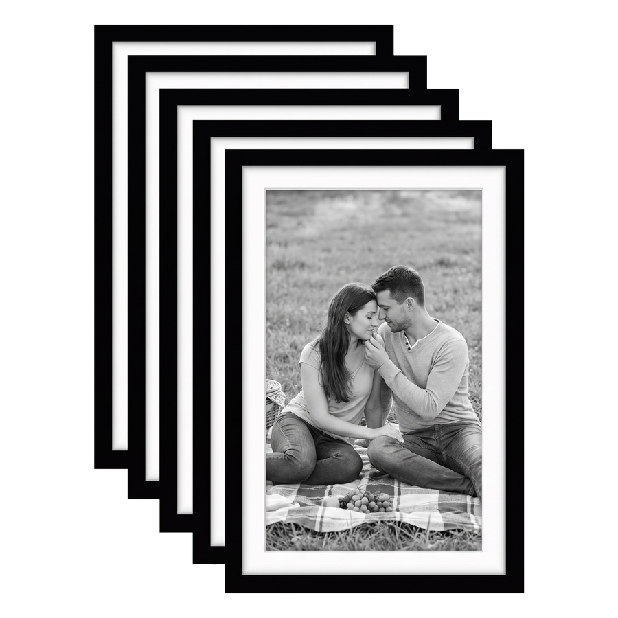 Five stacked black Galleria frames with white mats, holding a photo of a couple on a picnic rug 