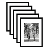 Five stacked black Galleria frames with white mats, holding a photo of a couple riding bicycles 