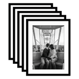 Five stacked black Galleria frames, 13x17, with 10x14 white mats, holding a photo of a couple on a Ferris wheel 