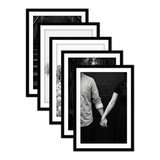 Five stacked black Galleria frames with white mats, holding a photo of a couple holding hands 