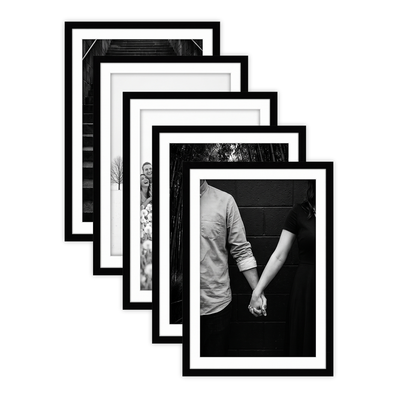 Five stacked black Galleria frames with white mats, holding a photo of a couple holding hands #flat