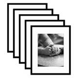 Five stacked black Galleria frames with white mats, holding a close photo of two hands held 