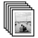 Five stacked black Galleria frames, 18x22, with 14x18 white mats, holding a photo of a couple at a harbour 