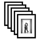 Five stacked black Galleria frames with white mats, holding a photo of a couple in a doorway 