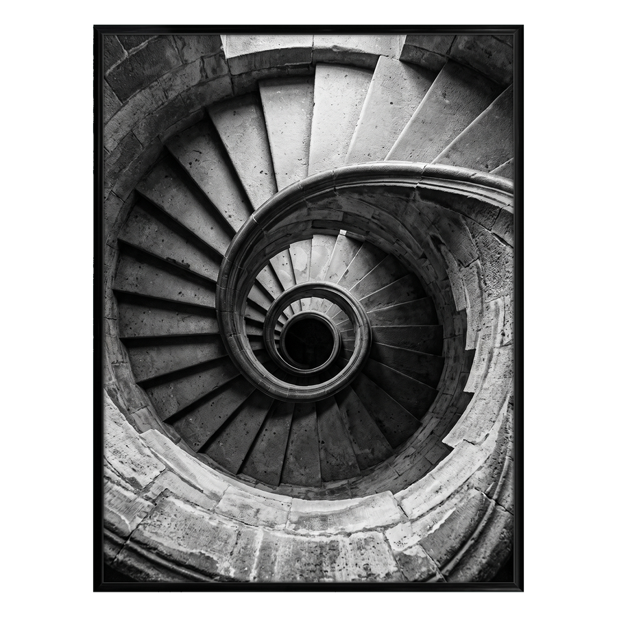 Black 18x24 Fusion frame holding a black-and-white photo of a stone spiral staircase from above 