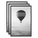 Three stacked black 11x17 Fusion frames all holding the same hot air balloon photo 