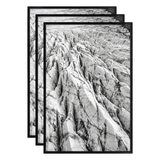 Three stacked black 12x18 Fusion frames all holding the same eroded rock ridge photo 