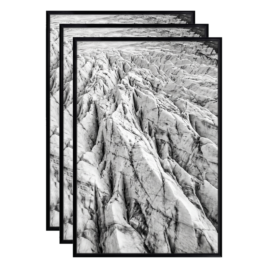 Three stacked black 12x18 Fusion frames all holding the same eroded rock ridge photo 