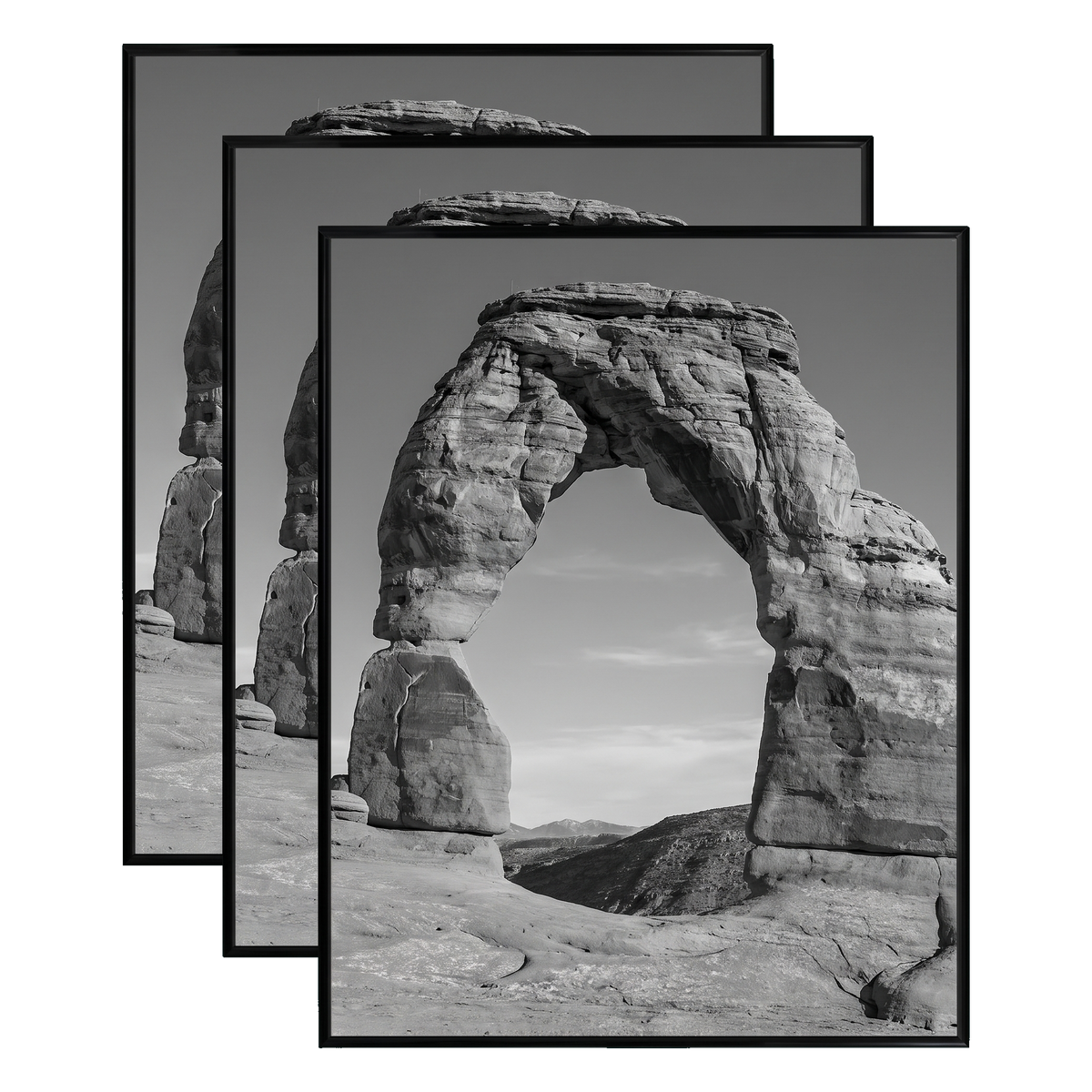 Three stacked black 22x28 Fusion frames all holding the same desert rock arch photo 