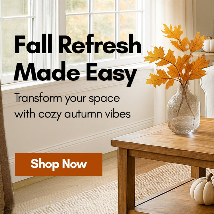 Living room with autumn decorations, including pumpkins and a photo frame on a coffee table.