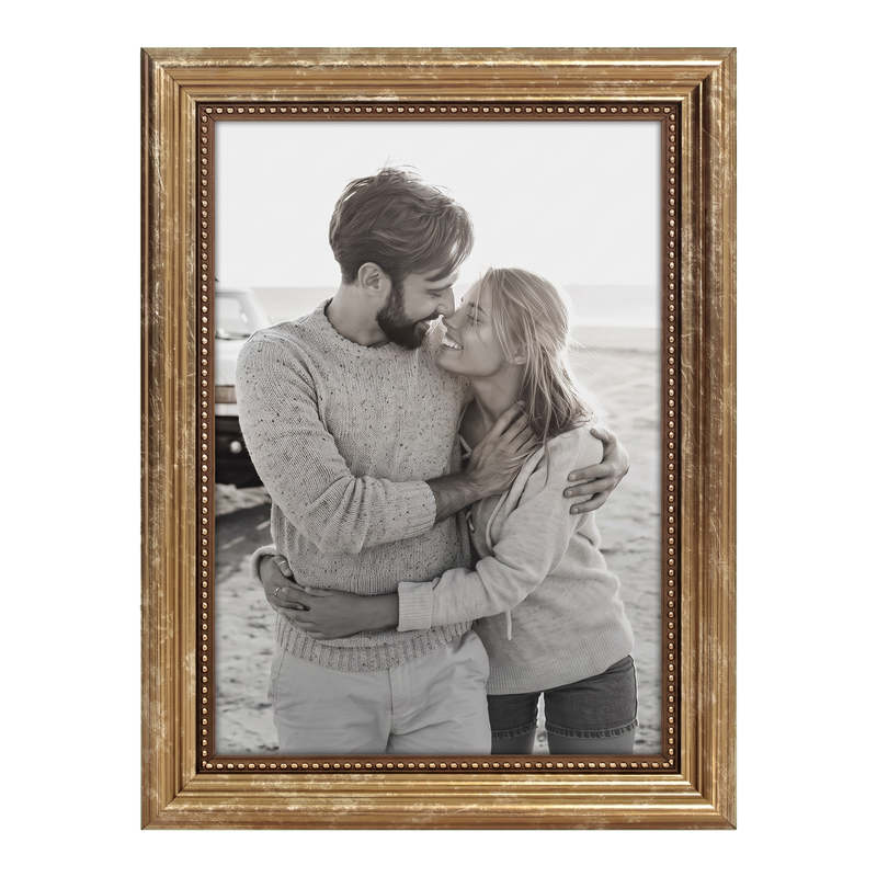 Gold beaded 5x7 Heirloom frame holding a photo of a couple beside a car #flat