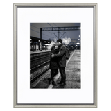 Silver beaded Heirloom frame, 16x20, holding a black-and-white photo of a couple embracing on a station platform