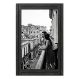 Black distressed 12x18 Hampton frame, a couple on a balcony above a city street 