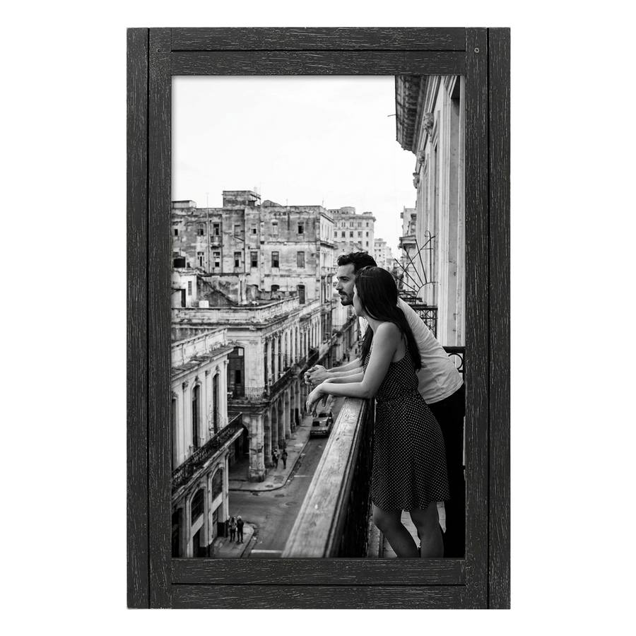 Black distressed 12x18 Hampton frame, a couple on a balcony above a city street 
