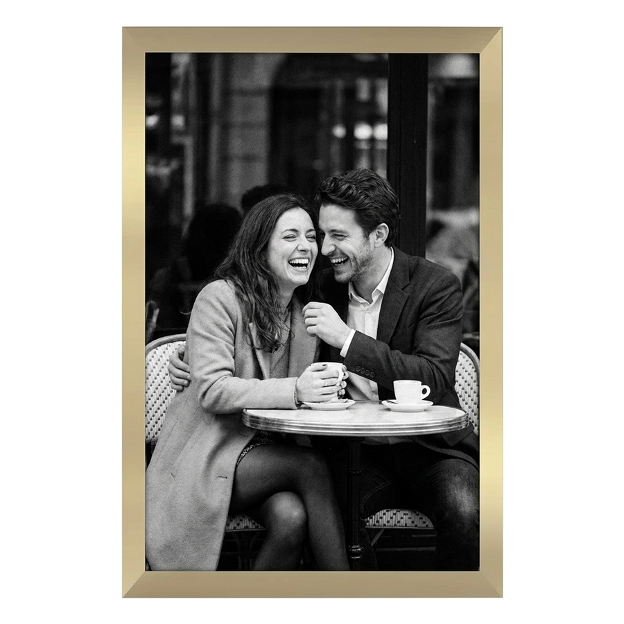 Gold Epic poster frame, 12x18, no mat, holding a black-and-white photo of a couple laughing at a cafe table #flat