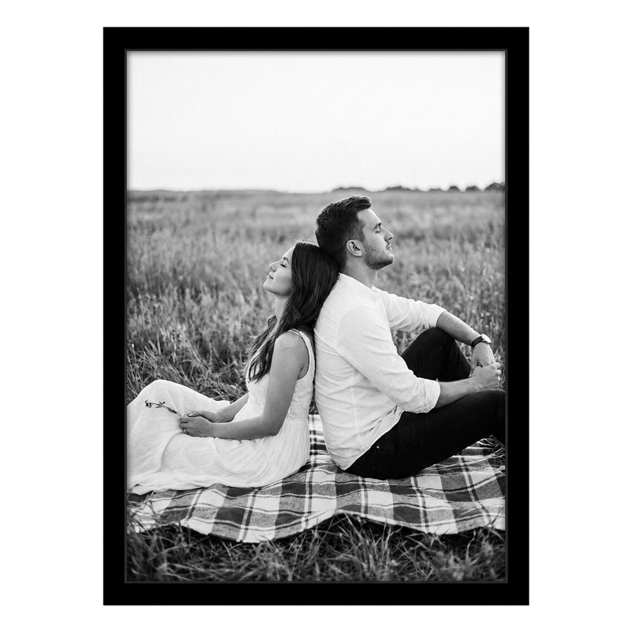 Black Epic poster frame, 19x25, no mat, holding a black-and-white photo of a couple on a picnic blanket 