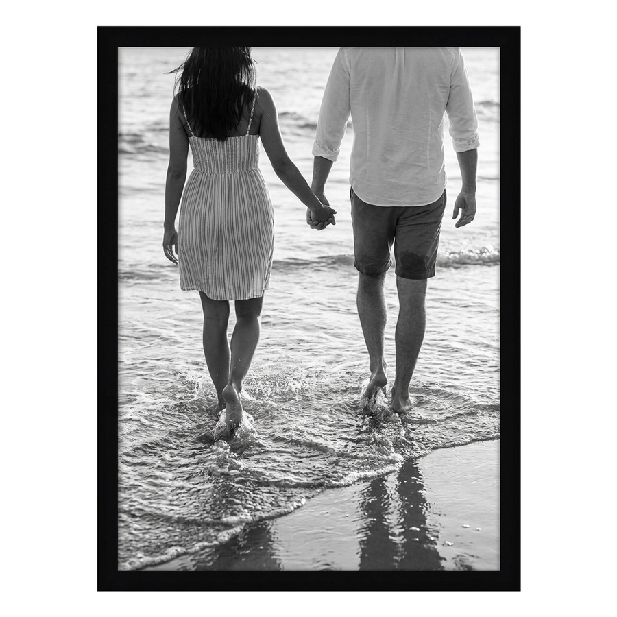 Black Epic poster frame, 30x40, no mat, holding a black-and-white photo of a couple wading at the shoreline 
