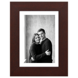 Mahogany Hudson frame, 5x7, with a 4x6 white mat, holding a black-and-white studio portrait of a couple 