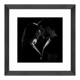 Black Hudson frame, 16x16, with a 12x12 white mat, holding a low-key black-and-white photo of a couple face to face 