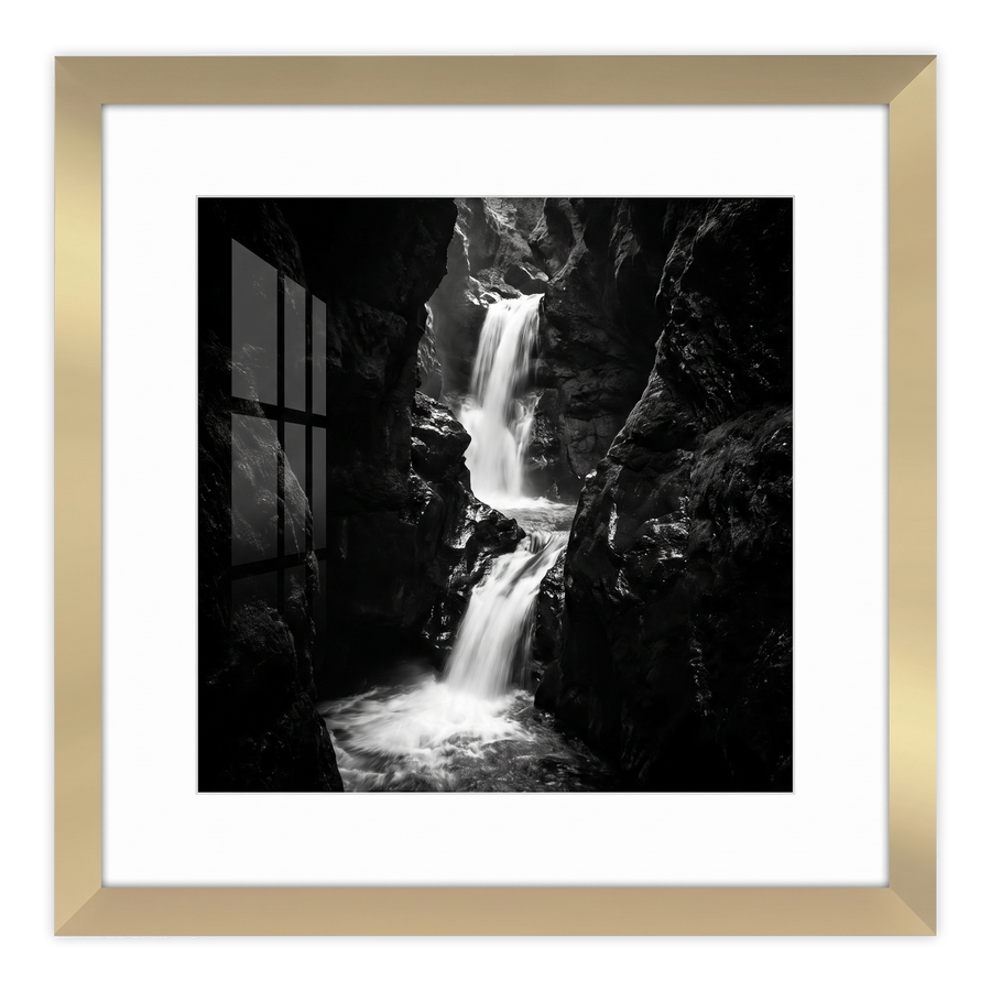 Gold Hudson frame, 16x16, with a 12x12 white mat, holding a black-and-white photo of a waterfall in a rocky gorge #flat