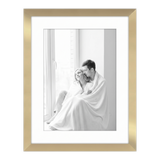 Gold Hudson frame, 16x20, 12x16 white mat, holding a black-and-white photo of a couple wrapped in a blanket 