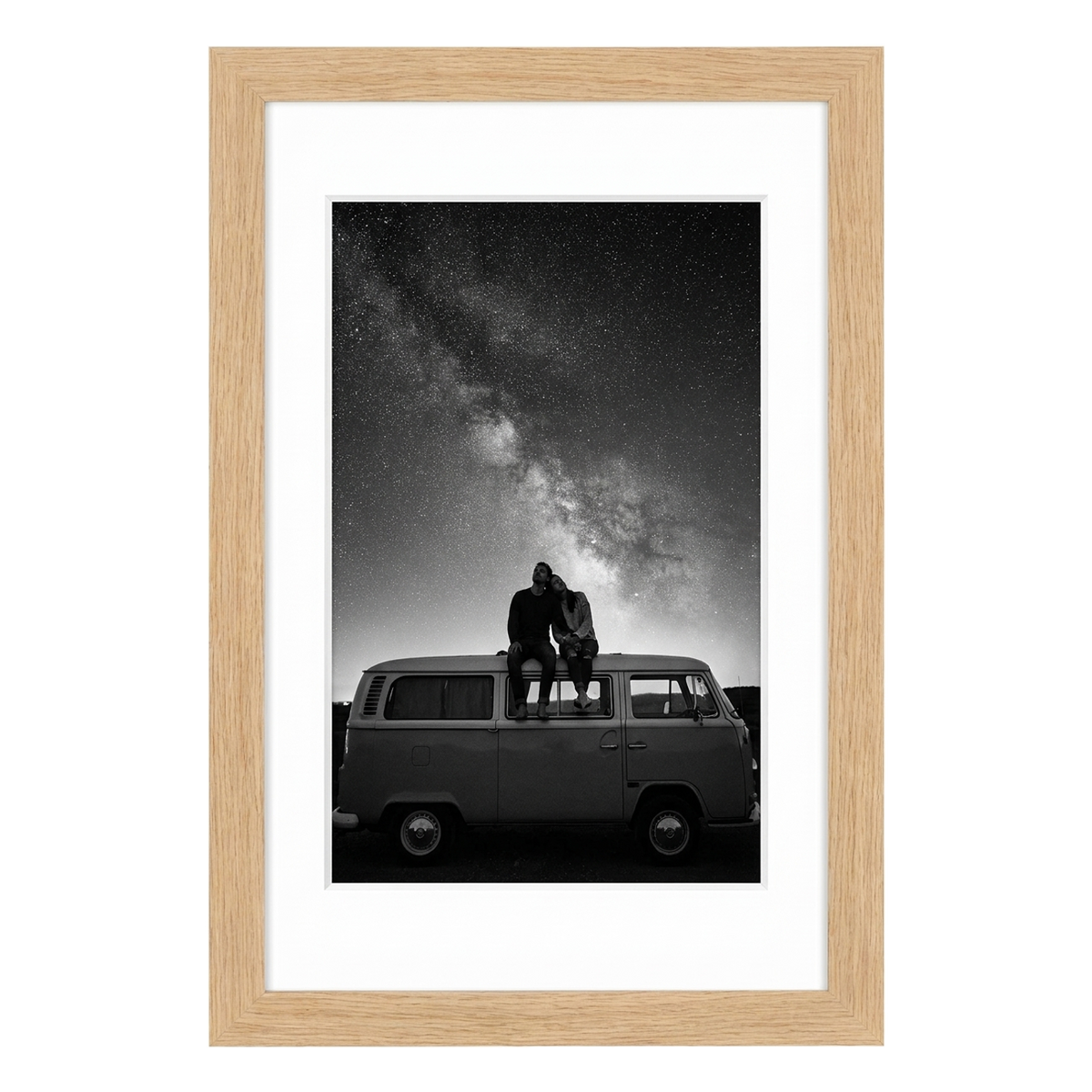 Natural oak Hudson frame, 16x24, with a 12x18 white mat, holding a black-and-white photo of a couple on a van beneath stars 