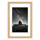 Natural oak Hudson frame, 16x24, with a 12x18 white mat, holding a black-and-white photo of a couple on a van beneath stars 