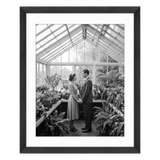 Black Hudson frame, 20x24, with a 16x20 white mat, holding a black-and-white photo of a couple in a greenhouse 