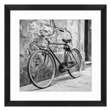 Black Hudson frame, 24x24, with a 20x20 white mat, holding a black-and-white photo of a bicycle against a stone wall 
