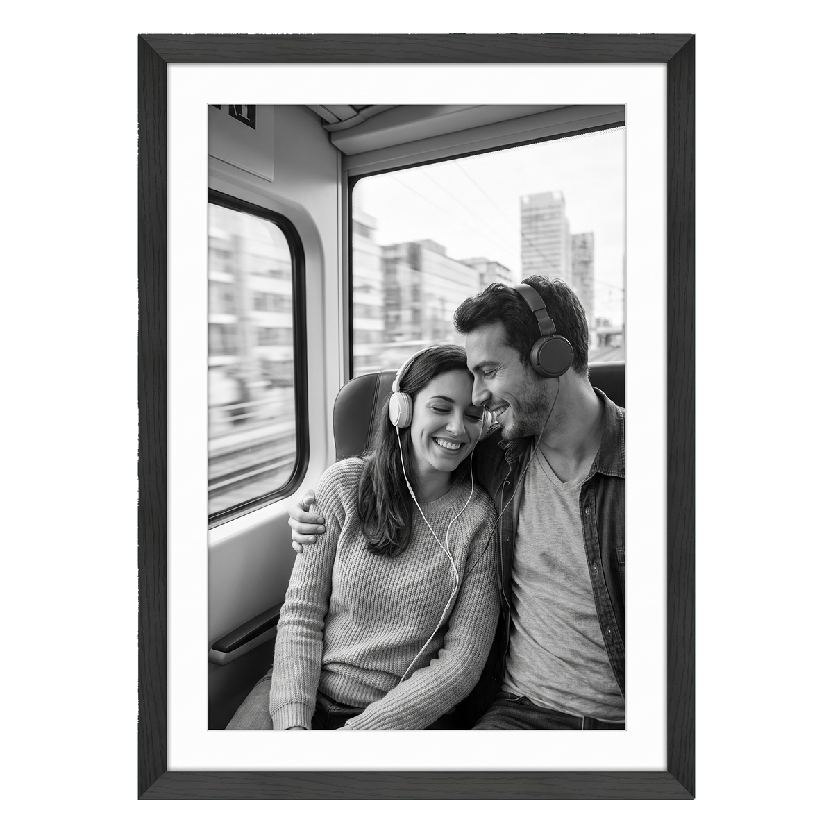 Black Hudson frame, 24x34, with a 20x30 white mat, holding a black-and-white photo of a couple with headphones on a train 