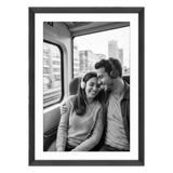 Black Hudson frame, 24x34, with a 20x30 white mat, holding a black-and-white photo of a couple with headphones on a train 