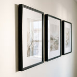 Angled view of the 16x22 frames showing the moulding profile and bevelled white mat 