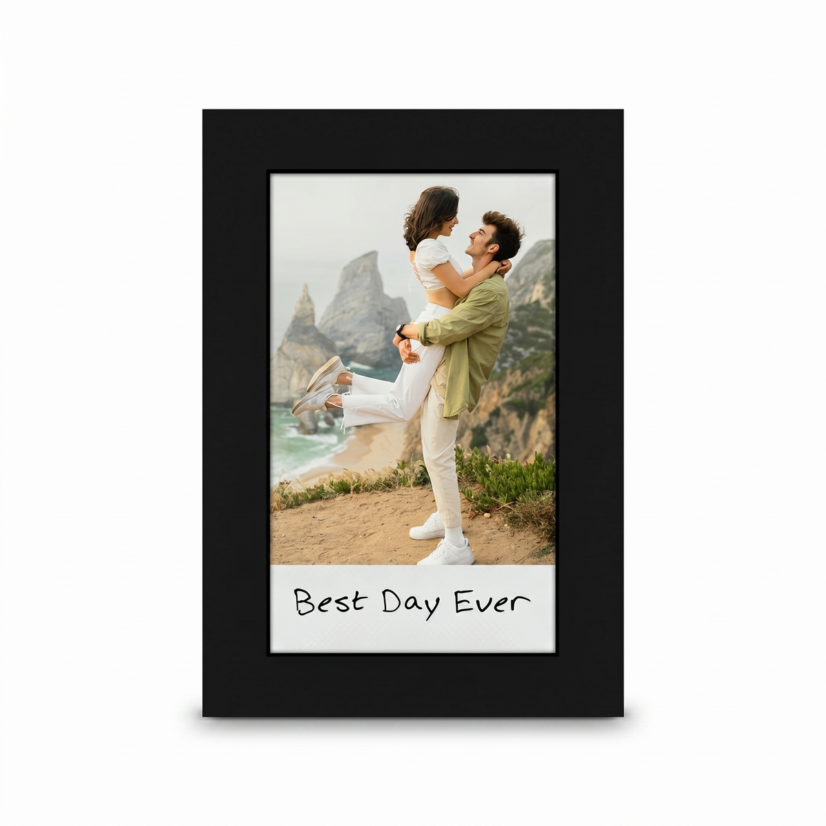 Black Instax frame on its easel stand, a couple on a clifftop captioned Best Day Ever 