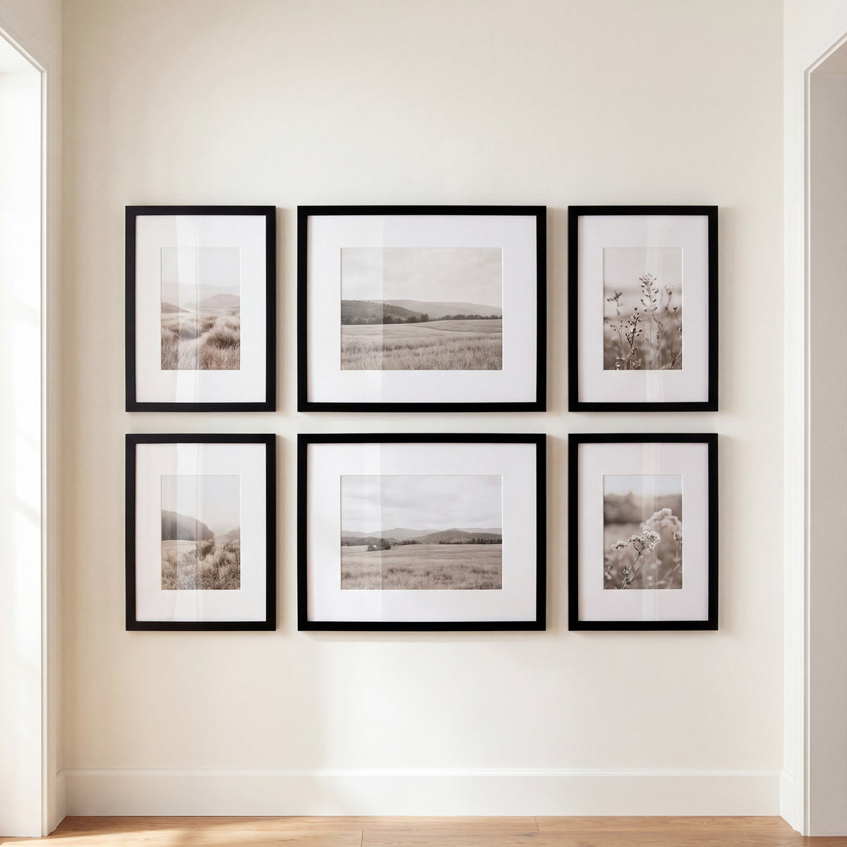 Six-frame black gallery wall grid on a hallway wall, four 8x10 and two 11x14 Streamline frames, all matted