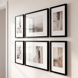 Angled view of the six-frame grid showing the slim black moulding sitting close to the wall