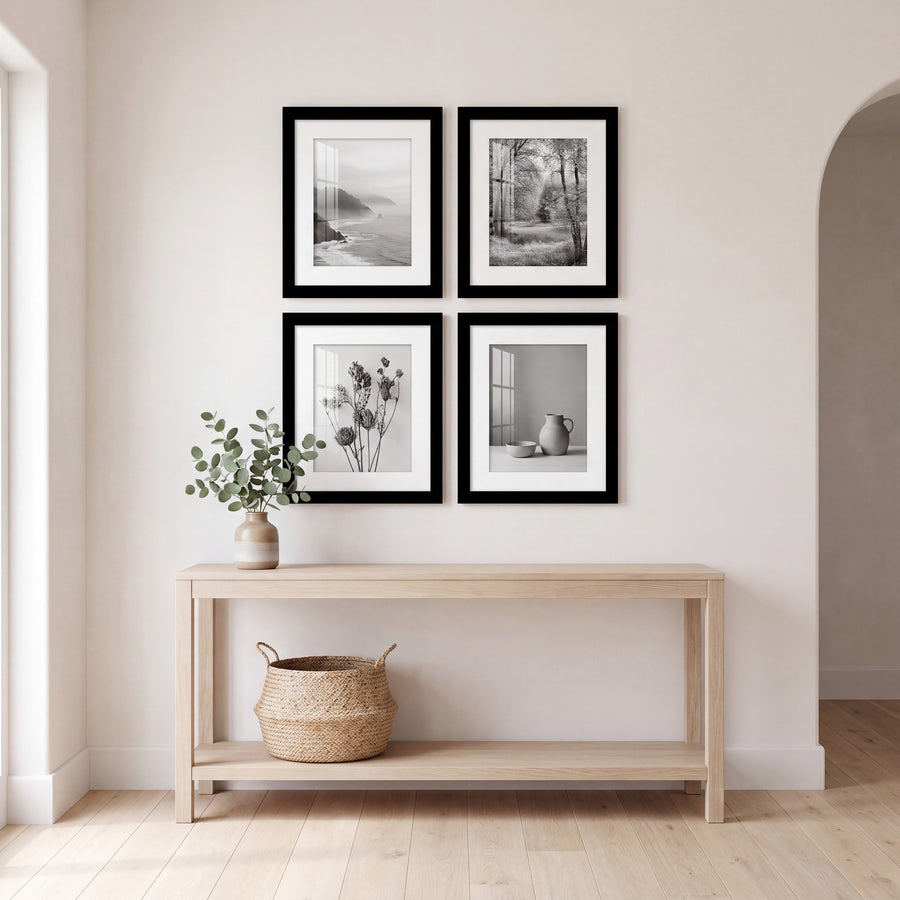 Entryway with four black Galleria frames hung as a two-by-two square above an oak console table