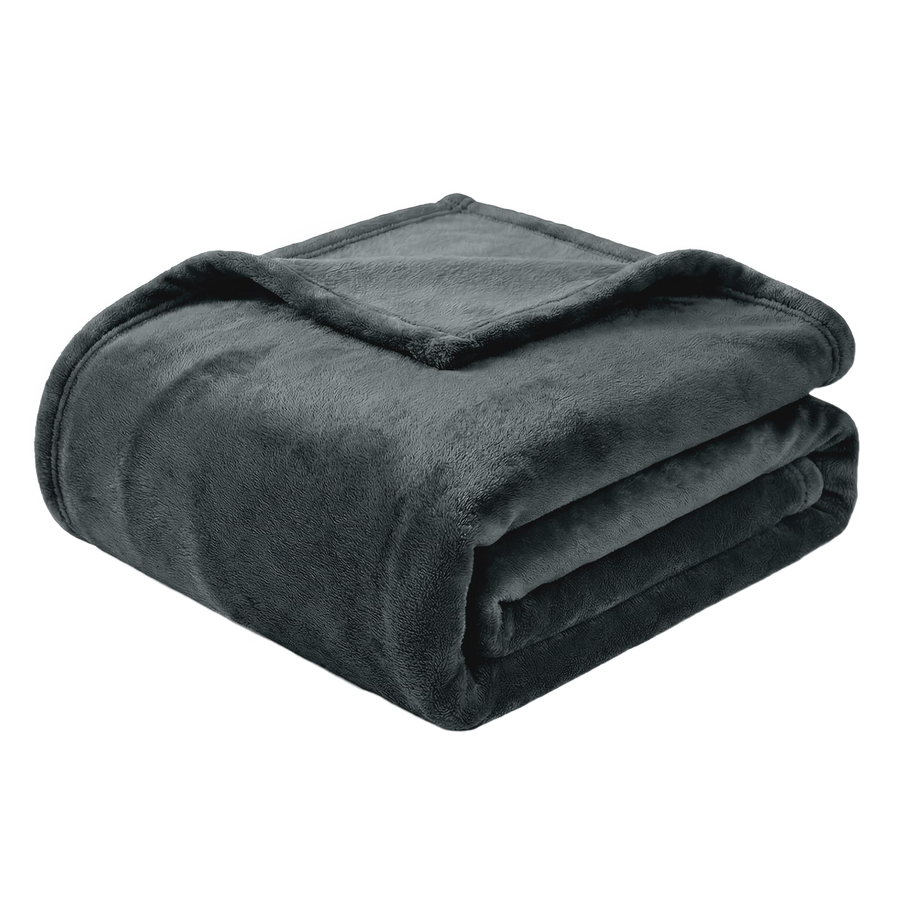 Folded green blanket on a white background 