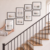 Hanging the last matted 11x14 to complete the clustered gallery wall