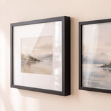 Close detail of a matted square frame beside the unmatted 9x12, both glazed