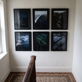 The six-frame grid on a stairwell landing wall 