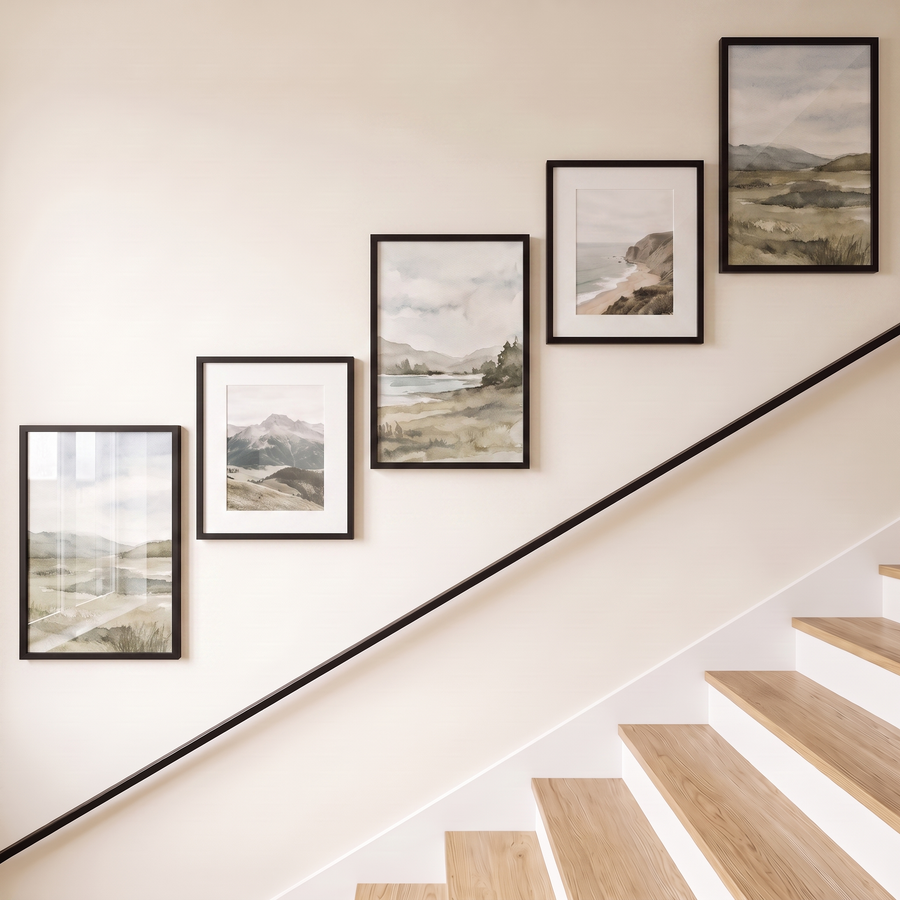 Open five-frame black gallery wall stepping up a staircase — three unmatted 12x18s and two matted 11x14s in one ascending line #flat