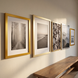The mixed-metals row seen along the wall at an angle in an entry hall 