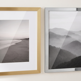 Close detail — satin brass with a white mat beside unmatted polished nickel 