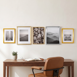The row above a walnut desk in a home office 